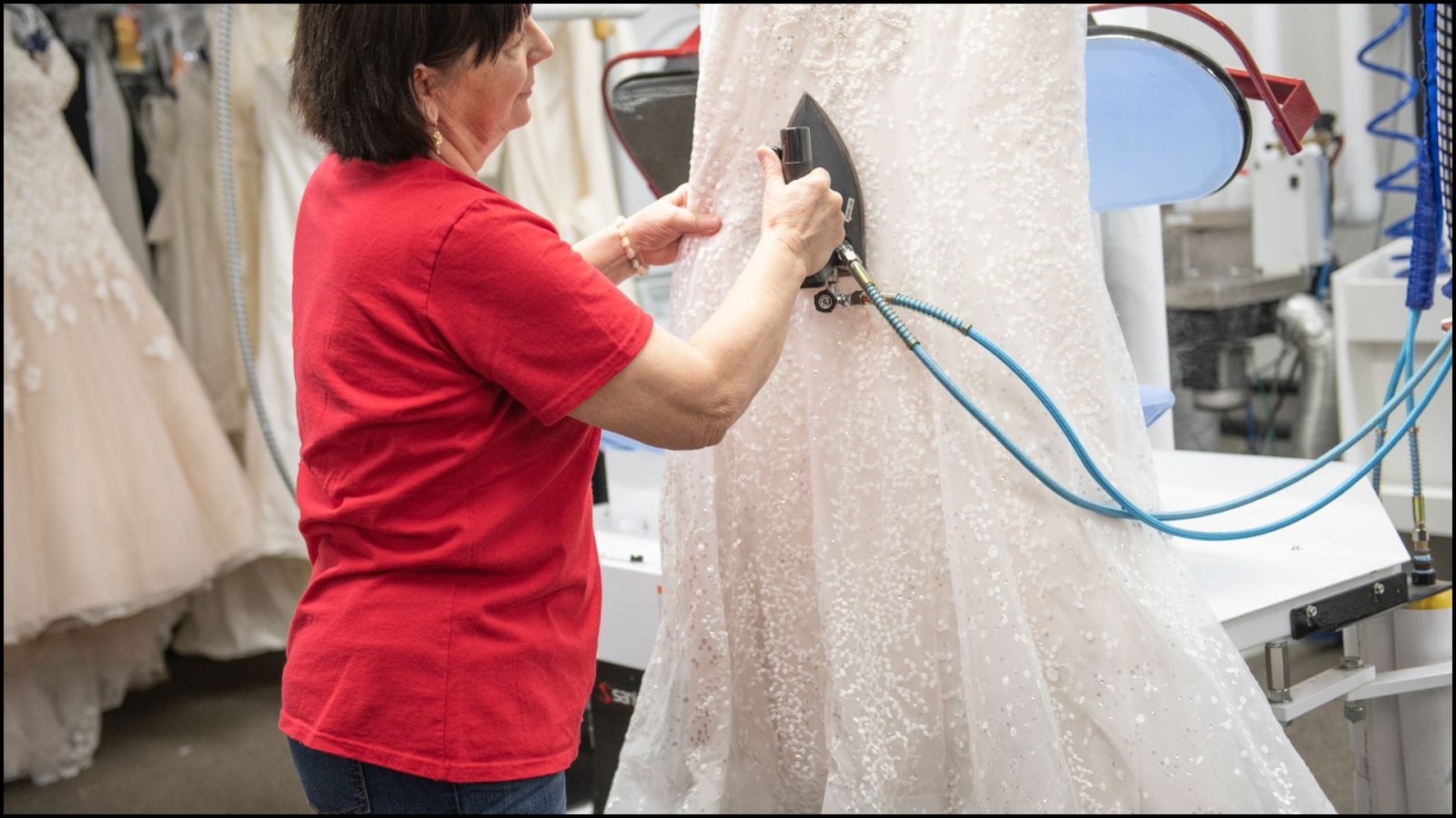A professional preserving a wedding dress